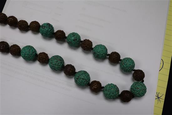 A carved turquoise and agate bead necklace.